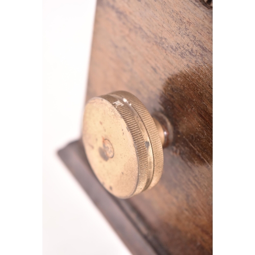 140 - National - an early 20th century oak cased time recorders clocking in machine. The glazed clock face... 