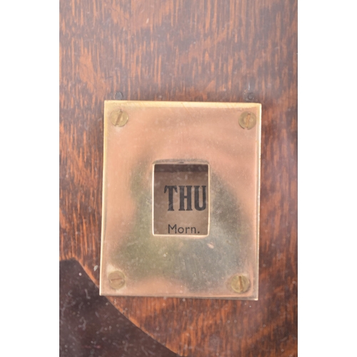 140 - National - an early 20th century oak cased time recorders clocking in machine. The glazed clock face... 