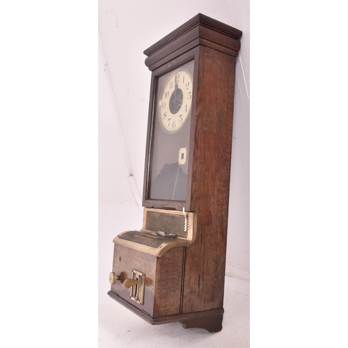 140 - National - an early 20th century oak cased time recorders clocking in machine. The glazed clock face... 