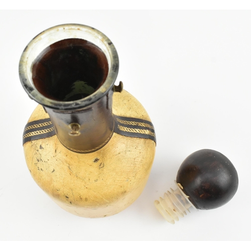 141 - An Italian vintage 20th century leather bound & glass crest decanter bottle. The decanter having... 