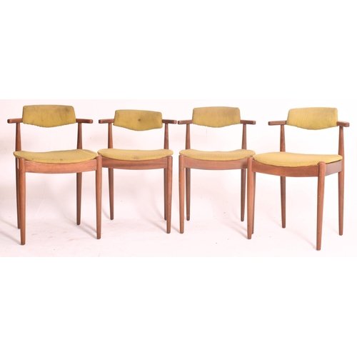 145 - A matching set of four retro 20th century Danish teak framed dining chairs. Each chair having black ... 