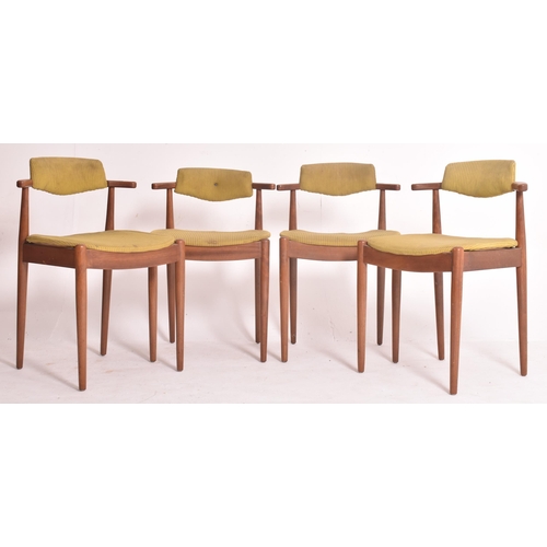 145 - A matching set of four retro 20th century Danish teak framed dining chairs. Each chair having black ... 