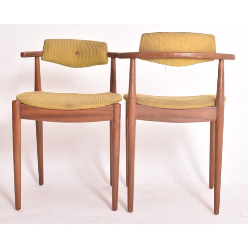 145 - A matching set of four retro 20th century Danish teak framed dining chairs. Each chair having black ... 