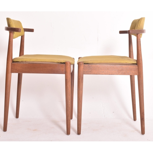 145 - A matching set of four retro 20th century Danish teak framed dining chairs. Each chair having black ... 