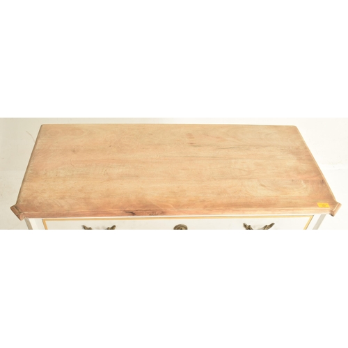 147 - A contemporary French-inspired oak-painted chest of drawers. The chest having a having a canted stri... 
