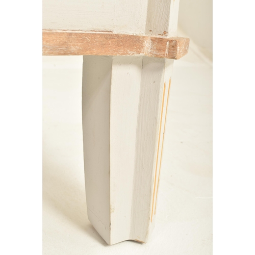 147 - A contemporary French-inspired oak-painted chest of drawers. The chest having a having a canted stri... 