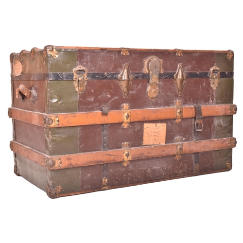 148 - A large early 20th century British steamer trunk travel chest. The trunk with green metal panels thr... 