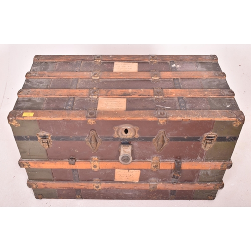 148 - A large early 20th century British steamer trunk travel chest. The trunk with green metal panels thr... 