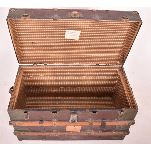 148 - A large early 20th century British steamer trunk travel chest. The trunk with green metal panels thr... 
