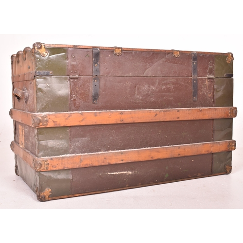 148 - A large early 20th century British steamer trunk travel chest. The trunk with green metal panels thr... 