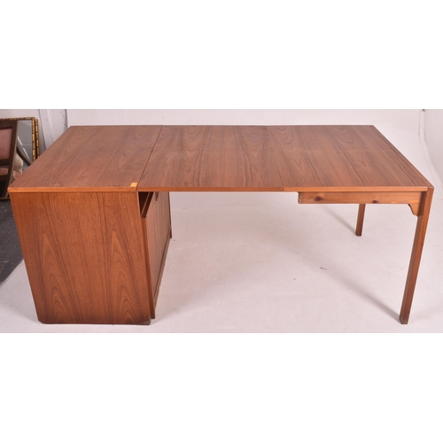 150 - A retro 20th century Danish designed teak metomorphic cupboard / dining table or desk believed to be... 