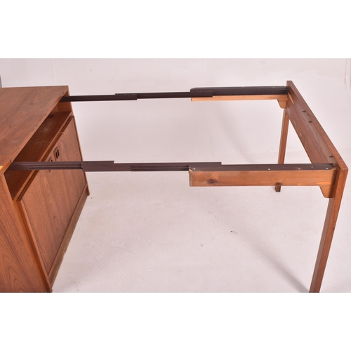 150 - A retro 20th century Danish designed teak metomorphic cupboard / dining table or desk believed to be... 
