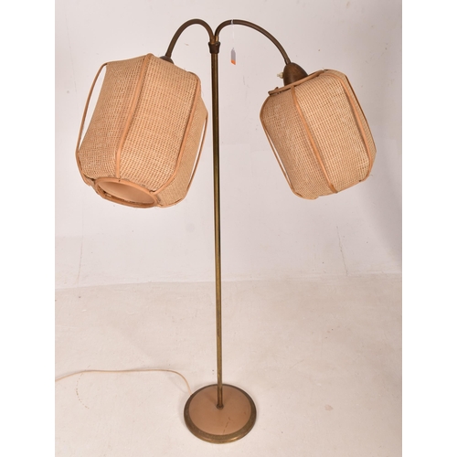 153 - A retro 1970s Boho floorstanding / standard lamp light. The lamp having twin gooseneck brass arms su... 