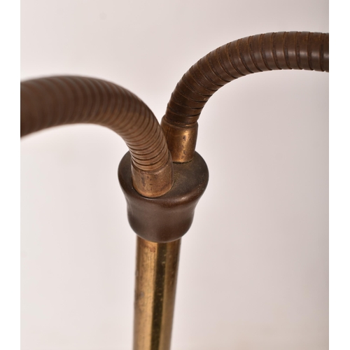 153 - A retro 1970s Boho floorstanding / standard lamp light. The lamp having twin gooseneck brass arms su... 