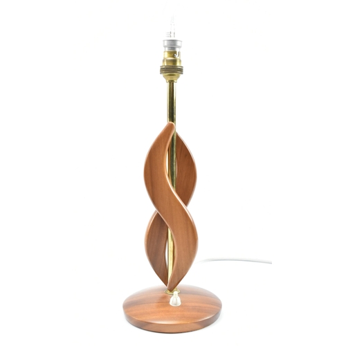 159 - British Modern Design - a mid 20th century circa 1960s atomic teak table lamp. The lamp having doubl... 