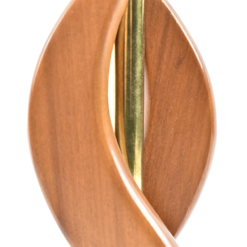 159 - British Modern Design - a mid 20th century circa 1960s atomic teak table lamp. The lamp having doubl... 