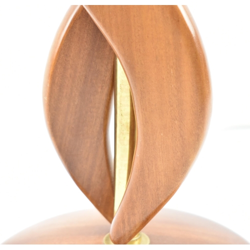 159 - British Modern Design - a mid 20th century circa 1960s atomic teak table lamp. The lamp having doubl... 