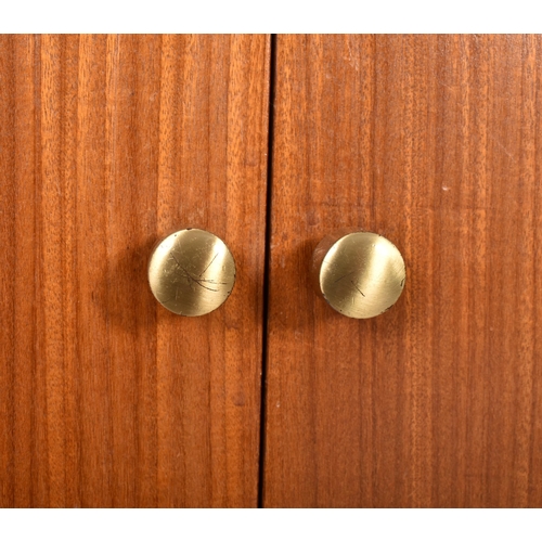 16 - A retro mid 20th century 1960s teak Hi-Fi record cabinet. The cabinet having twin doors opening to r... 