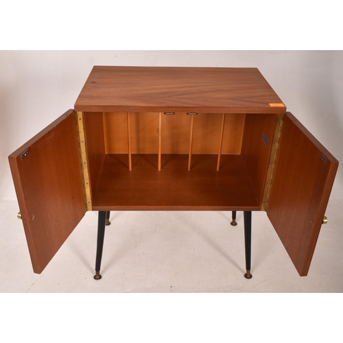 16 - A retro mid 20th century 1960s teak Hi-Fi record cabinet. The cabinet having twin doors opening to r... 