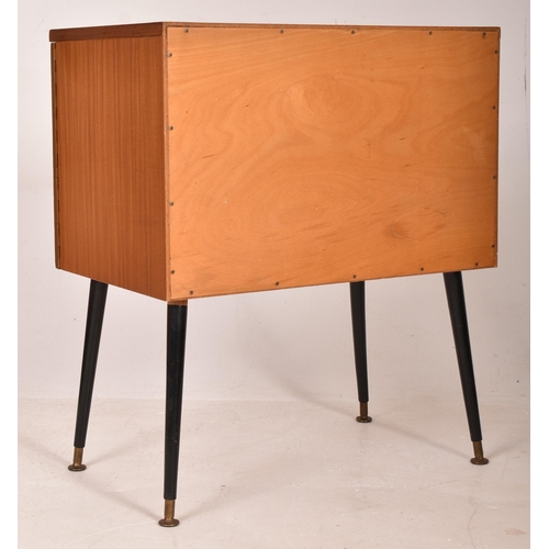 16 - A retro mid 20th century 1960s teak Hi-Fi record cabinet. The cabinet having twin doors opening to r... 