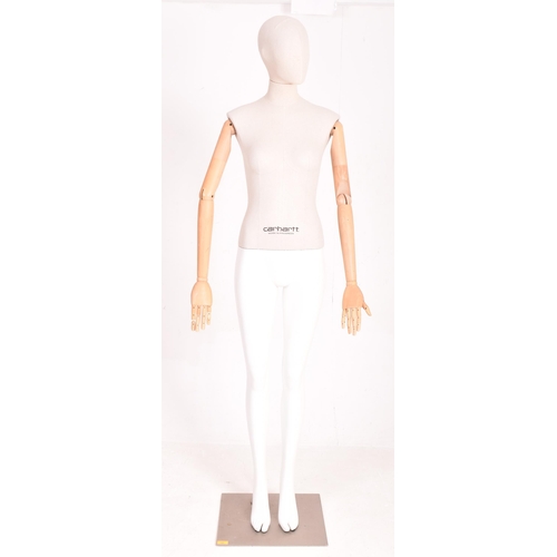 162 - Carhartt Clothing - a modern, full-bodied shop display articulated female mannequin. The mannequin h... 