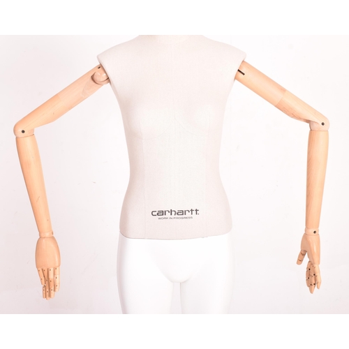 162 - Carhartt Clothing - a modern, full-bodied shop display articulated female mannequin. The mannequin h... 