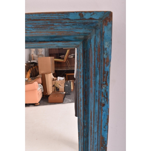165 - A large shabby chic bespoke vintage painted wooden wall hanging mirror. The mirror having a canted f... 