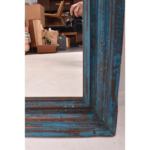 165 - A large shabby chic bespoke vintage painted wooden wall hanging mirror. The mirror having a canted f... 
