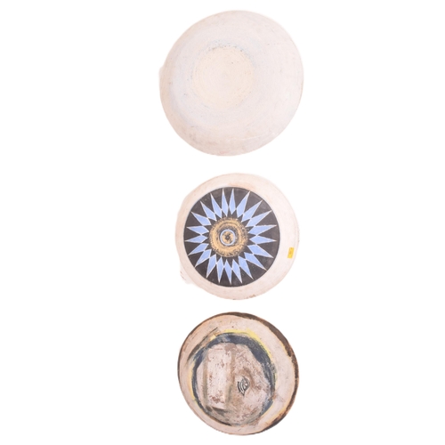 166 - A selection of 20th century studio art pottery charger plates. Each charger being hand-painted and m... 