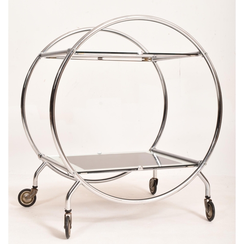 168 - A vintage 20th century Art Deco style two tier cocktail drinks trolley. The circular chrome frame su... 