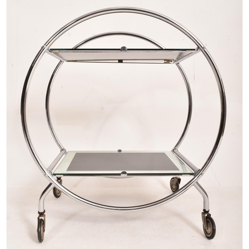 168 - A vintage 20th century Art Deco style two tier cocktail drinks trolley. The circular chrome frame su... 