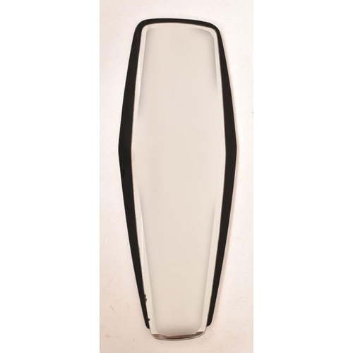 17 - A vintage 20th century Art Deco black glass framed hanging mirror. The mirror having a shaped mirror... 