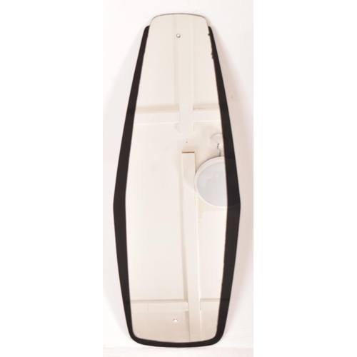 17 - A vintage 20th century Art Deco black glass framed hanging mirror. The mirror having a shaped mirror... 