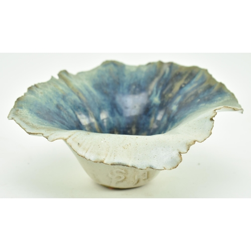 177 - A studio art pottery glazed ceramic vase. The vase having a flared napkin-style rim with blue tones ... 
