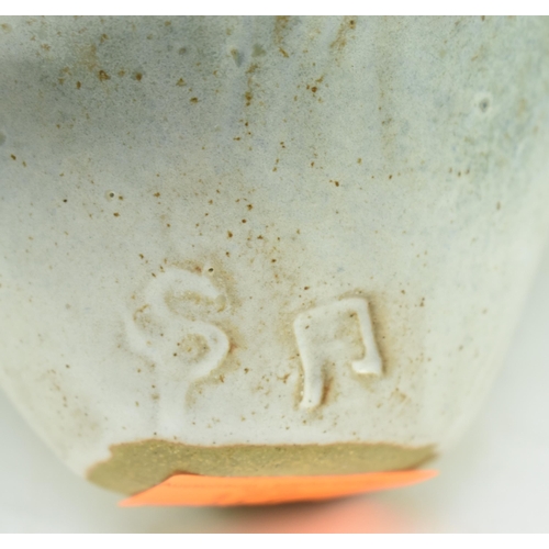 177 - A studio art pottery glazed ceramic vase. The vase having a flared napkin-style rim with blue tones ... 