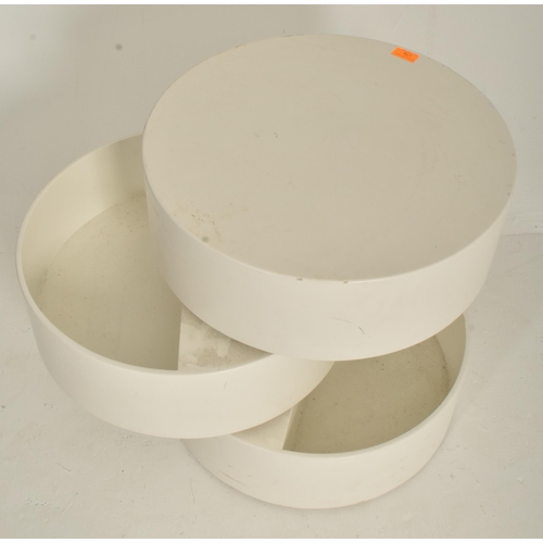 178 - An Italian style retro mid 20th century white moulded plastic rotating storage side coffee table. Th... 
