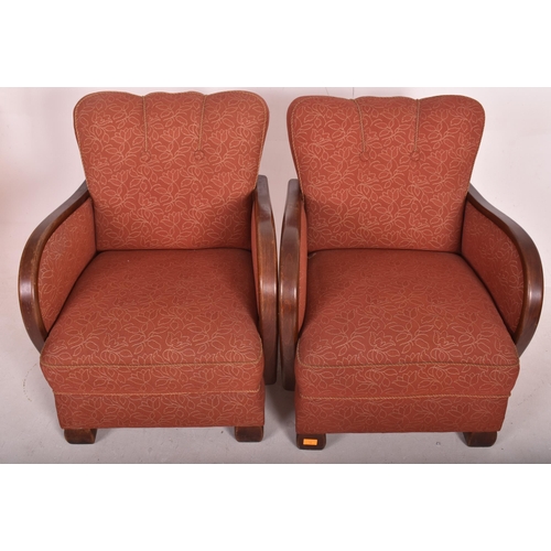 18 - A matching pair of vintage 20th century 1930s Art Deco club armchairs. Each chair having overstuffed... 