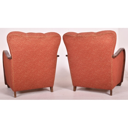 18 - A matching pair of vintage 20th century 1930s Art Deco club armchairs. Each chair having overstuffed... 