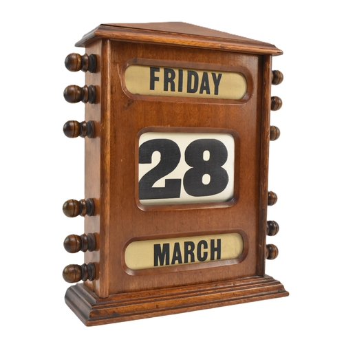 20 - A large mid century circa 1940s mahogany framed desk table perpetual calendar. The calendar with thr... 