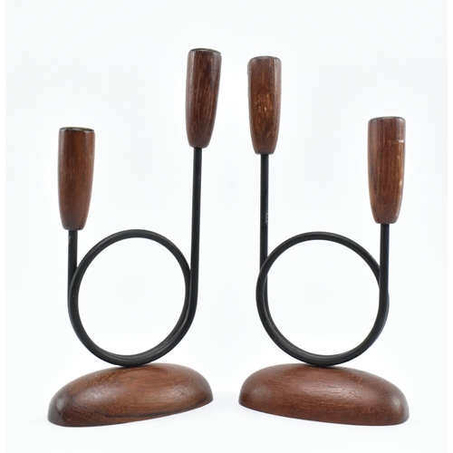 21 - A pair of retro 20th century Danish design candlestick holders. The candlesticks having two turned t... 