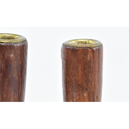 21 - A pair of retro 20th century Danish design candlestick holders. The candlesticks having two turned t... 