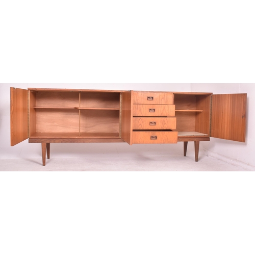25 - Danish Modern Design - a retro mid 20th century teak wood sideboard credenza. The sideboard having a... 