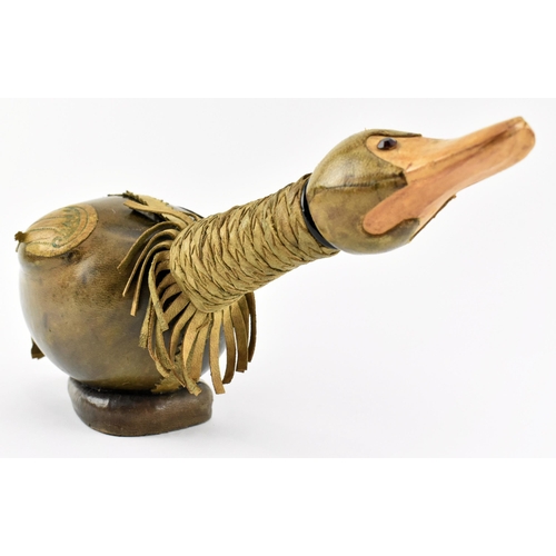 36 - An Italian Empoli style 20th century leather and glass duck decanter bottle. The bottle having a duc... 