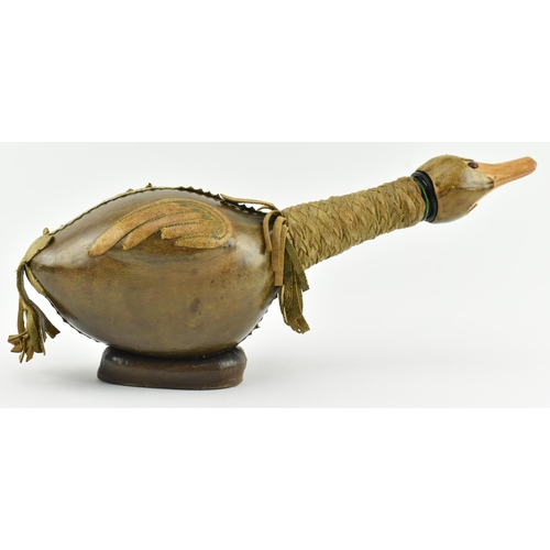 36 - An Italian Empoli style 20th century leather and glass duck decanter bottle. The bottle having a duc... 