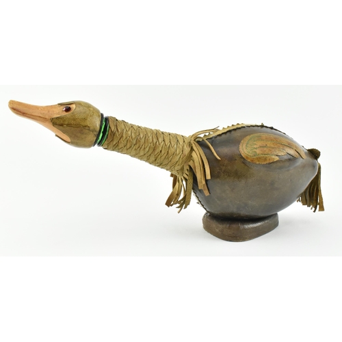 36 - An Italian Empoli style 20th century leather and glass duck decanter bottle. The bottle having a duc... 
