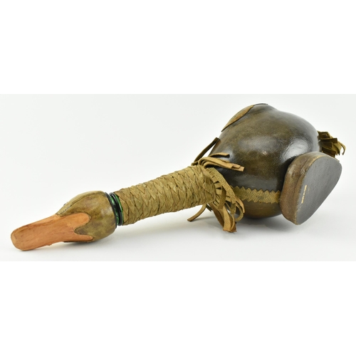 36 - An Italian Empoli style 20th century leather and glass duck decanter bottle. The bottle having a duc... 