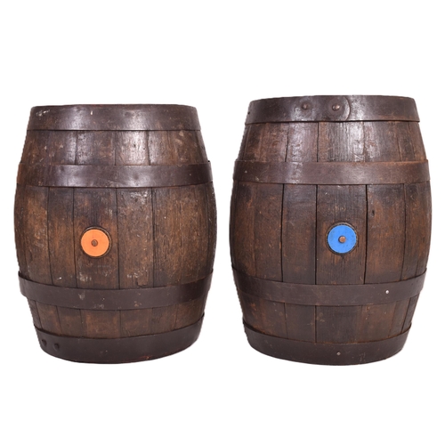 38 - Wadworth Devizes - a pair of wooden and metal bound coopered beer barrels / side lamp tables. Each o... 
