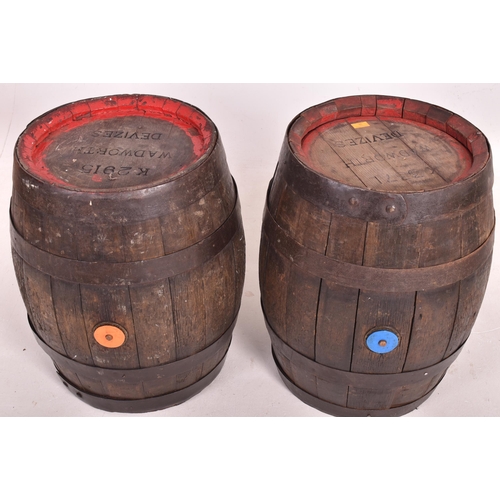 38 - Wadworth Devizes - a pair of wooden and metal bound coopered beer barrels / side lamp tables. Each o... 