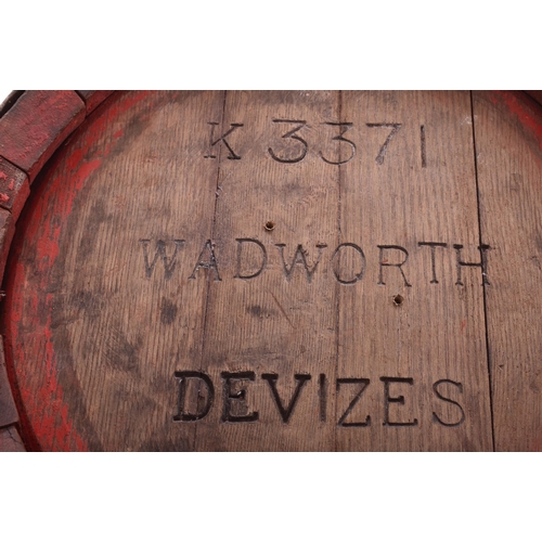 38 - Wadworth Devizes - a pair of wooden and metal bound coopered beer barrels / side lamp tables. Each o... 