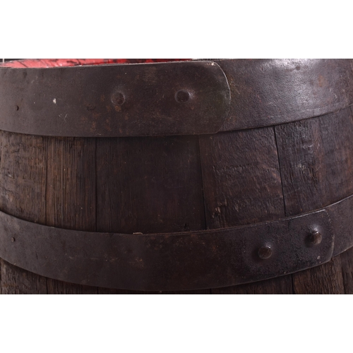38 - Wadworth Devizes - a pair of wooden and metal bound coopered beer barrels / side lamp tables. Each o... 